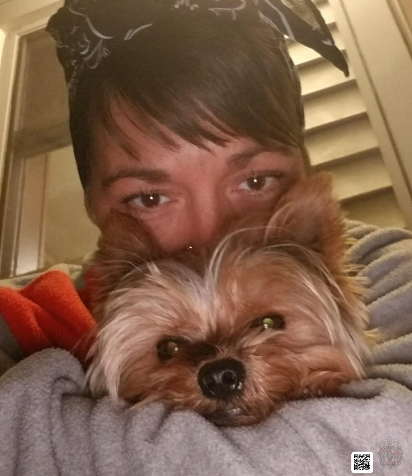 Crystal cheek-to-cheek with Tucker, her first Yorkshire Terrier